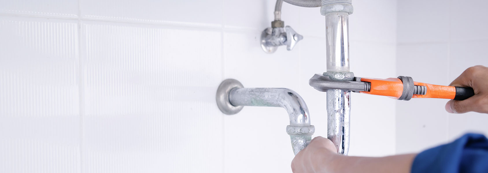 Plumber Working On Sink